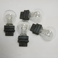 Wagner brake light bulb with dual wire design showing plastic alignment dots and 16mm socket