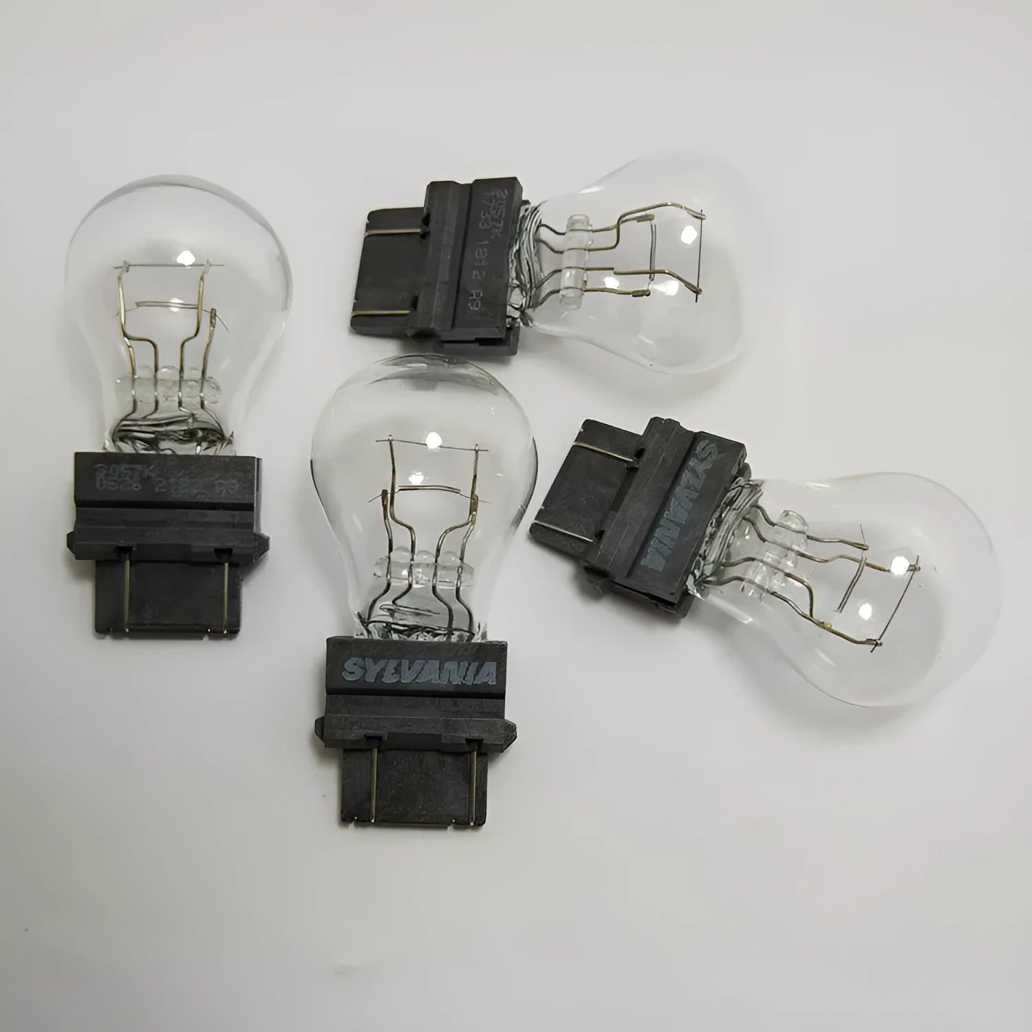 Wagner brake light bulb with dual wire design showing plastic alignment dots and 16mm socket