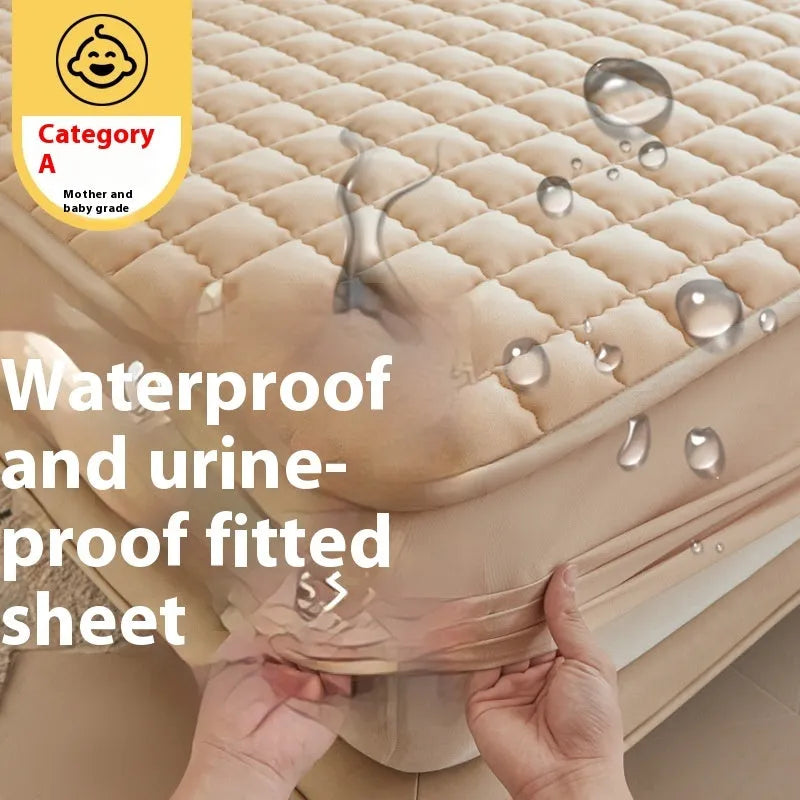 Class A waterproof fitted sheet in washed cotton, shown in a neutral colour on a bed.