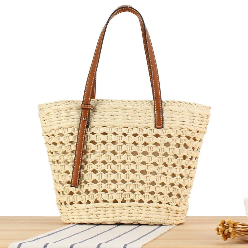 Horizontal square shoulder bag woven from paper-string with adjustable strap in beige colour