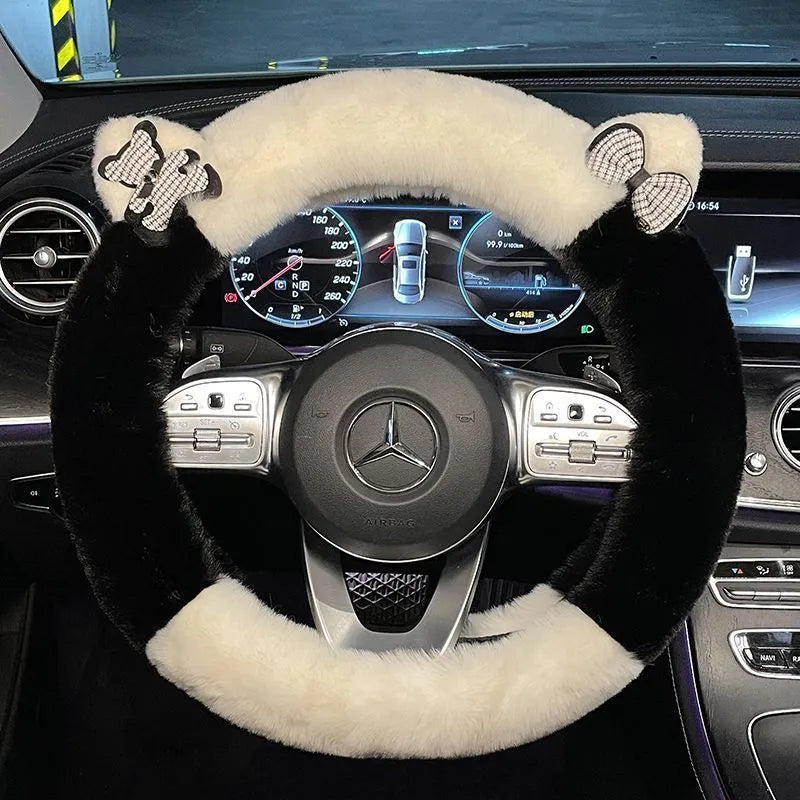 Milk tea white plush steering wheel cover with cute panda ears design on a car steering wheel