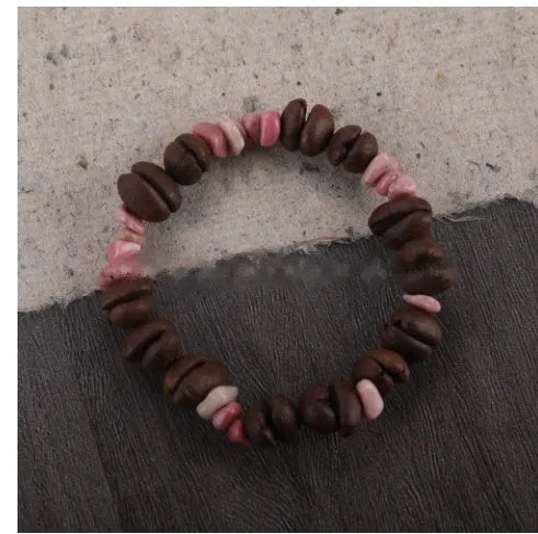 Handmade coffee bean bracelet with 16mm geometric charm showing colour variations