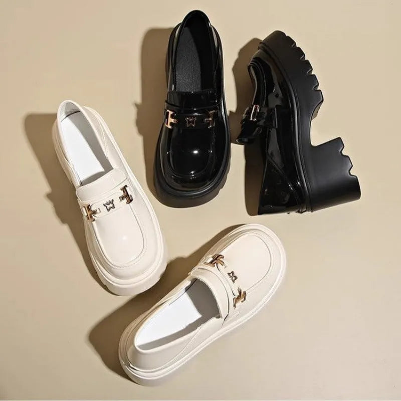 Black slip-on shoes with chunky square heel, round toe, and skull pattern on EVA upper