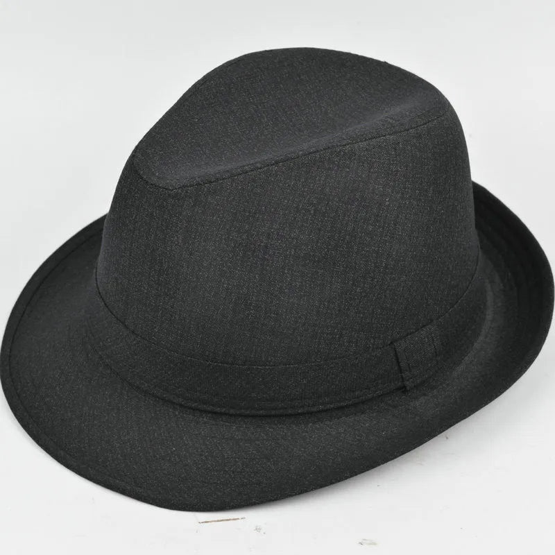 Classic brown fedora hat for men on a wooden stand, showing pinched crown and medium brim.