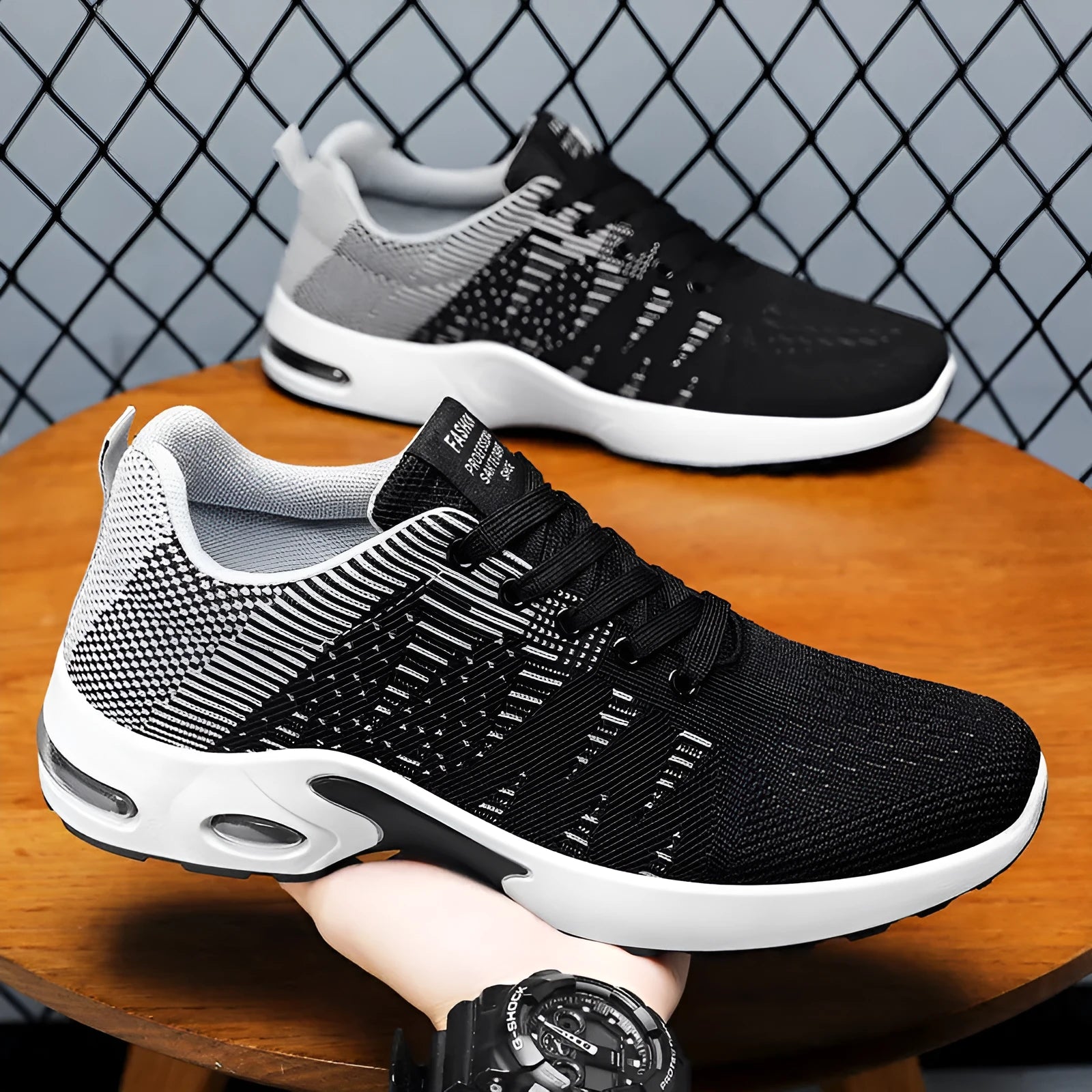 Men's low-top Flyknit mesh sneakers in black with coloured accents on an injection moulded sole