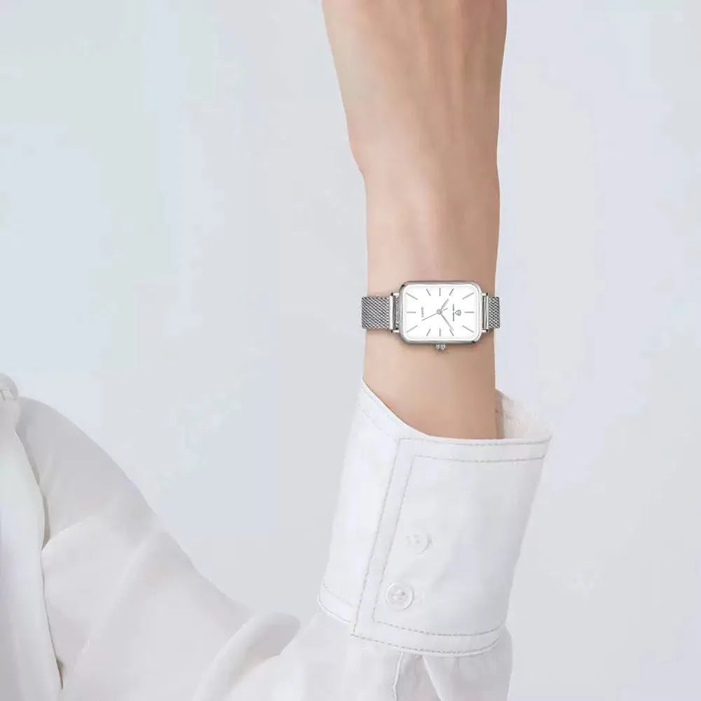 Women's rose gold waterproof quartz watch with alloy case and woven steel strap.