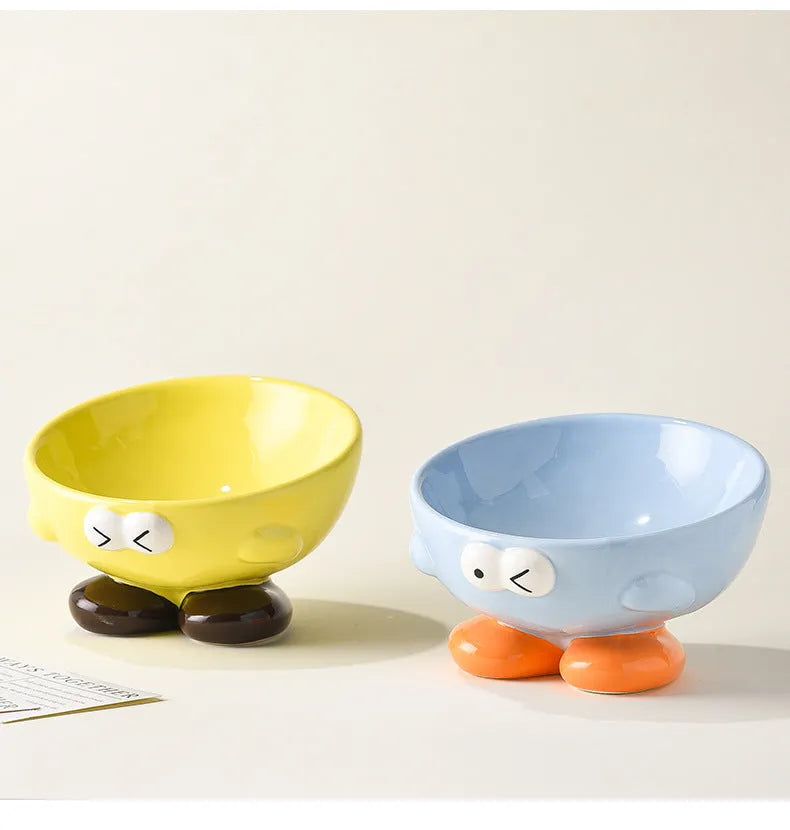 Cute Expression tall slanted ceramic pet food bowl in blue and yellow colours for cats and dogs