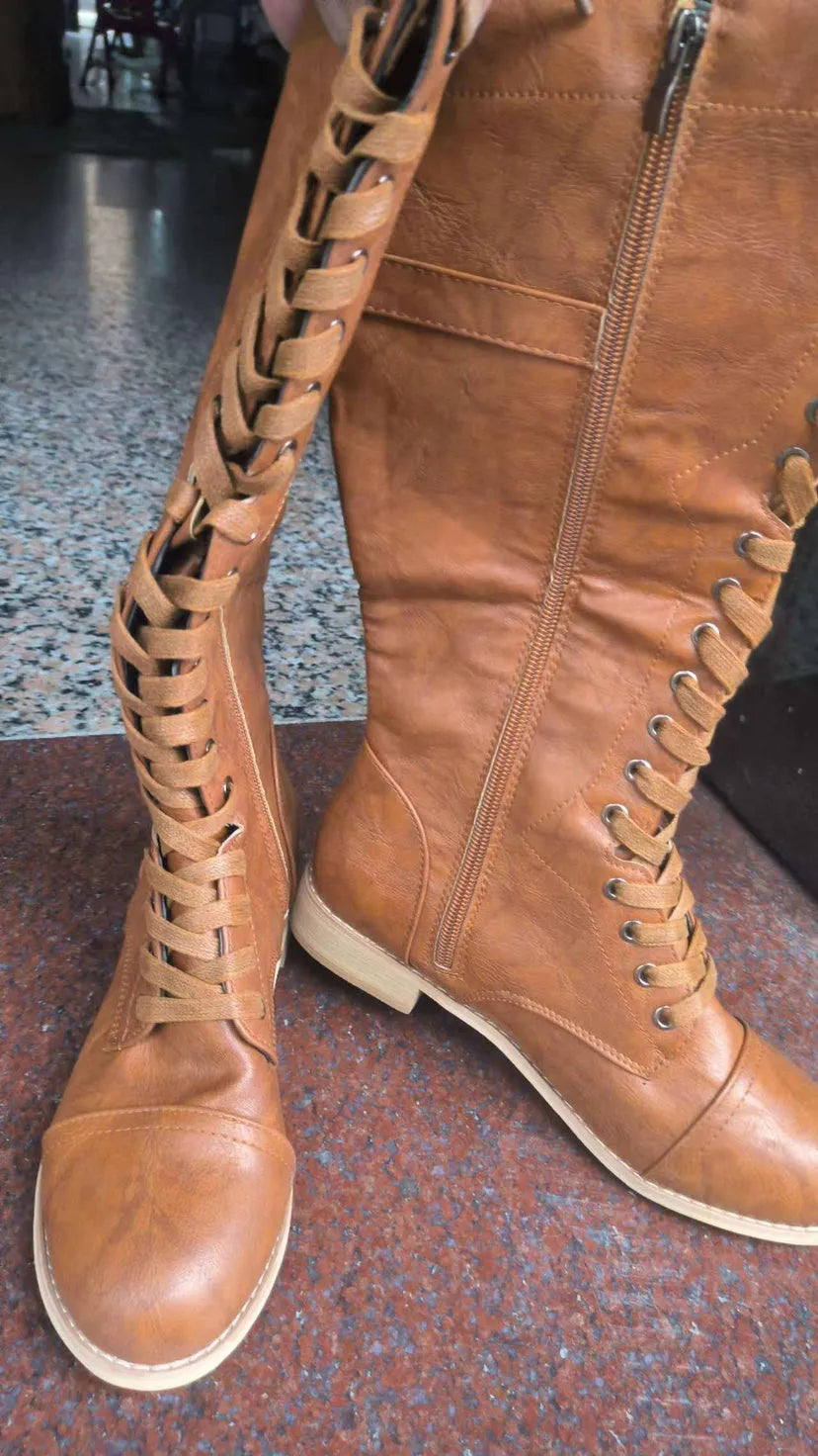 Women's black cross strap knight boots with zip closure in artificial PU material