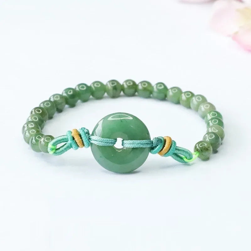 Emerald green jade bracelet with Chinese safety buckle and star-shaped 6mm beads.