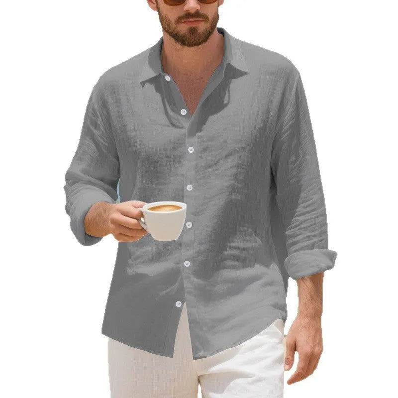Man wearing a light blue loose-fit linen casual shirt with a button front and classic collar.