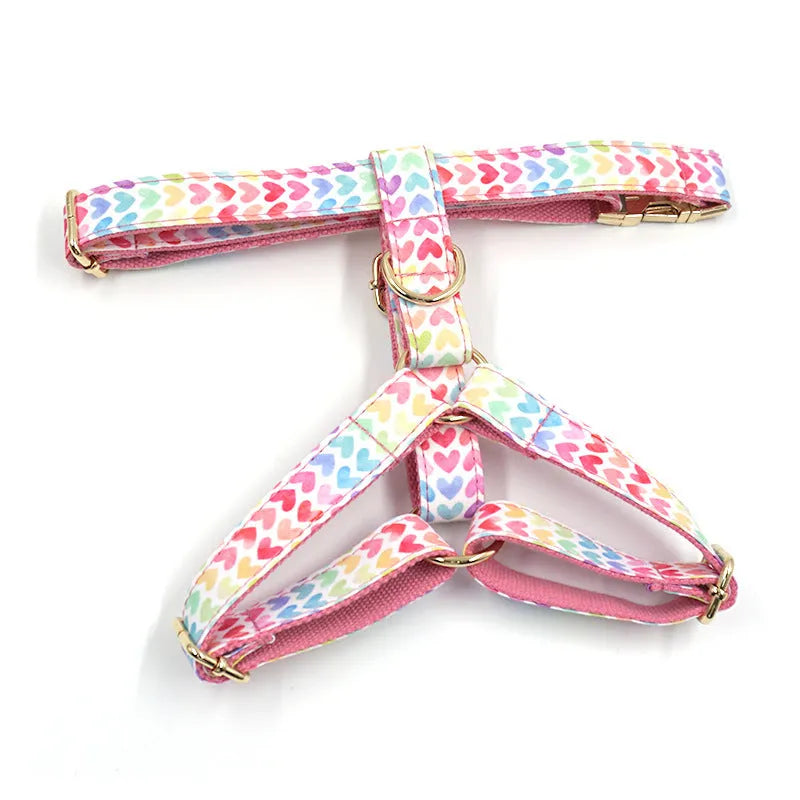 Pink colourful heart stone dog harness with gold buckle on a polyester chest and back strap.