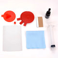 Car windscreen repair kit box containing UV lamp, green resin syringe, injection tools, and yellow bracket.