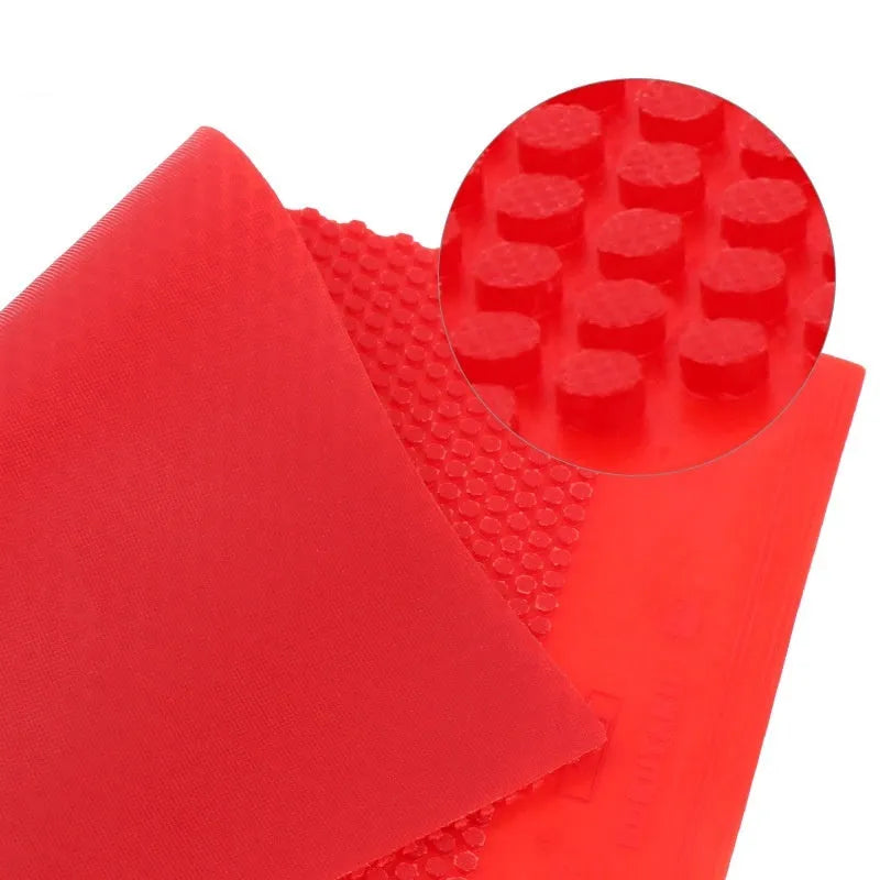 Single sheet of small particle table tennis rubber in black and red colour options.