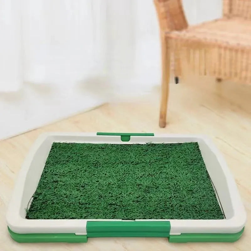 Green artificial grass dog toilet tray measuring 54cm by 38cm with three-layer construction