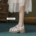 Women's retro platform sandals with closed toe, chunky heel and buckle fastening in black colour