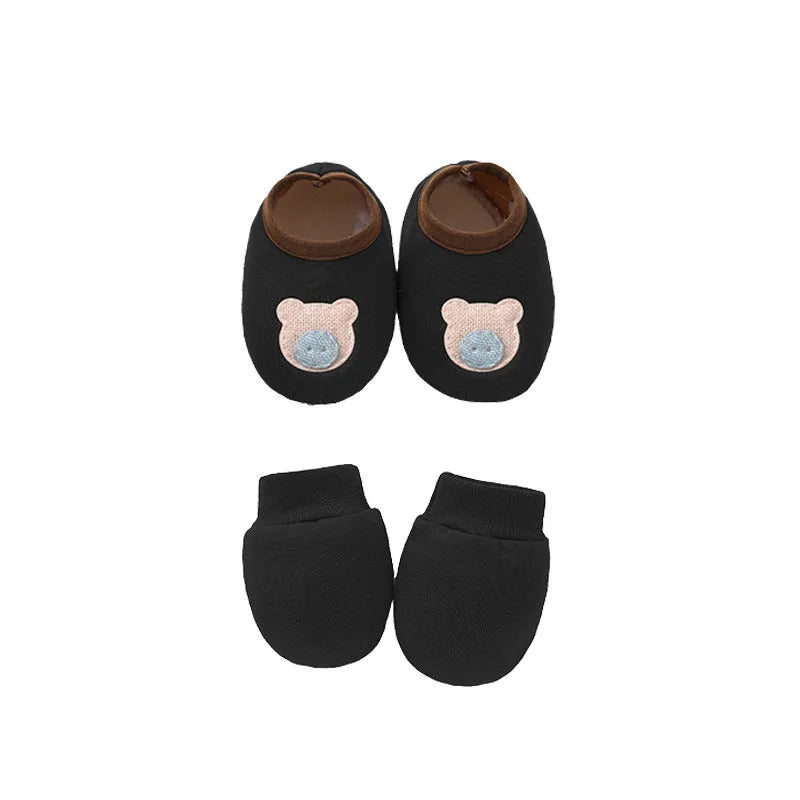 Set of white, light blue, and grey cotton baby pullover caps, gloves, and foot covers for infants.