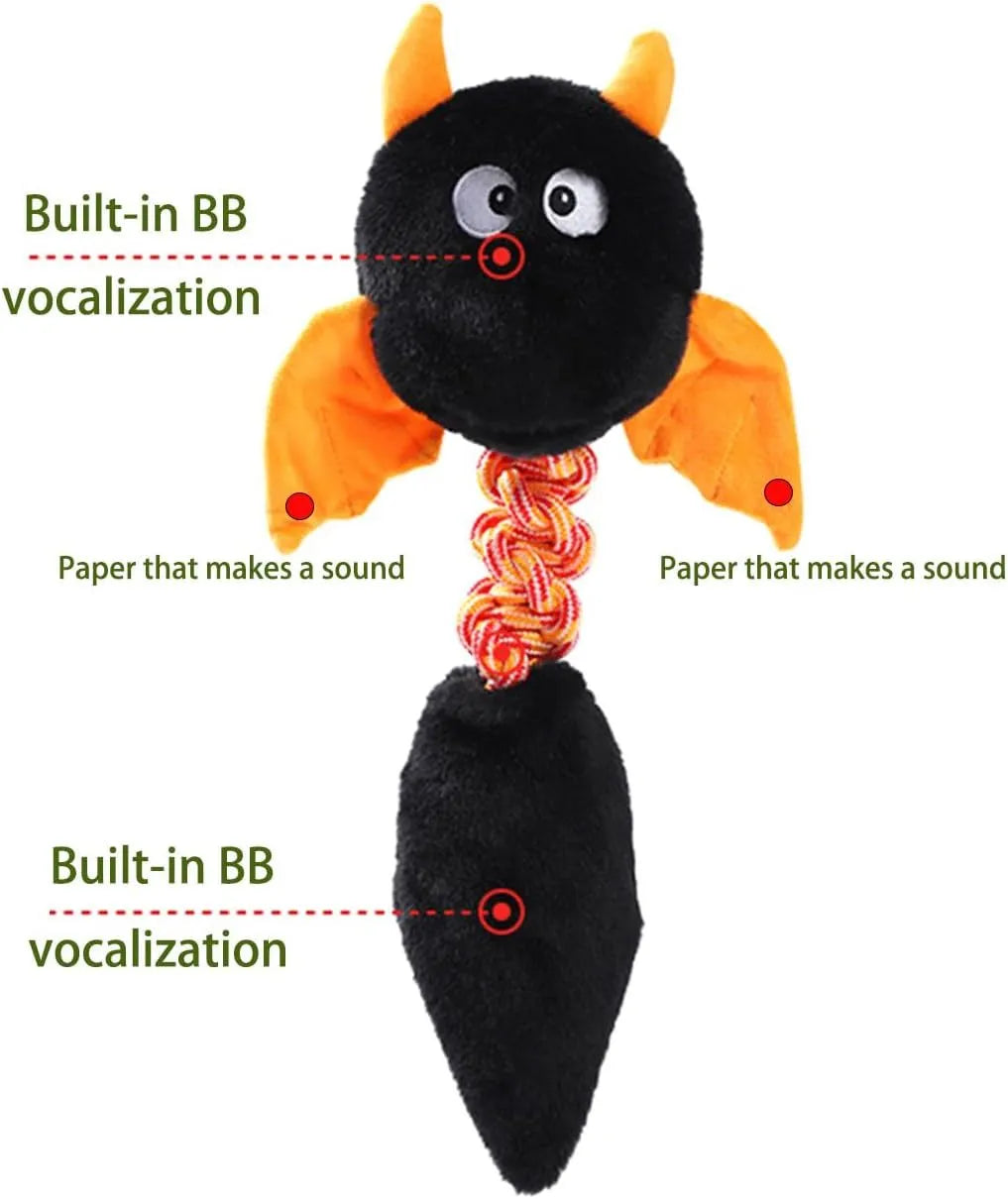 Plush cartoon dog toy with a squeaker and integrated rope knot on a green background.
