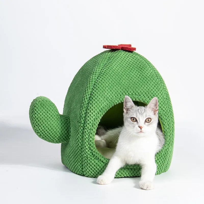 Green cactus-shaped enclosed cat bed tent with a plush cushion inside for kittens or small dogs.