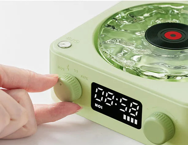 Retro Bluetooth speaker with rotating transparent turntable and RGB projection lighting effects