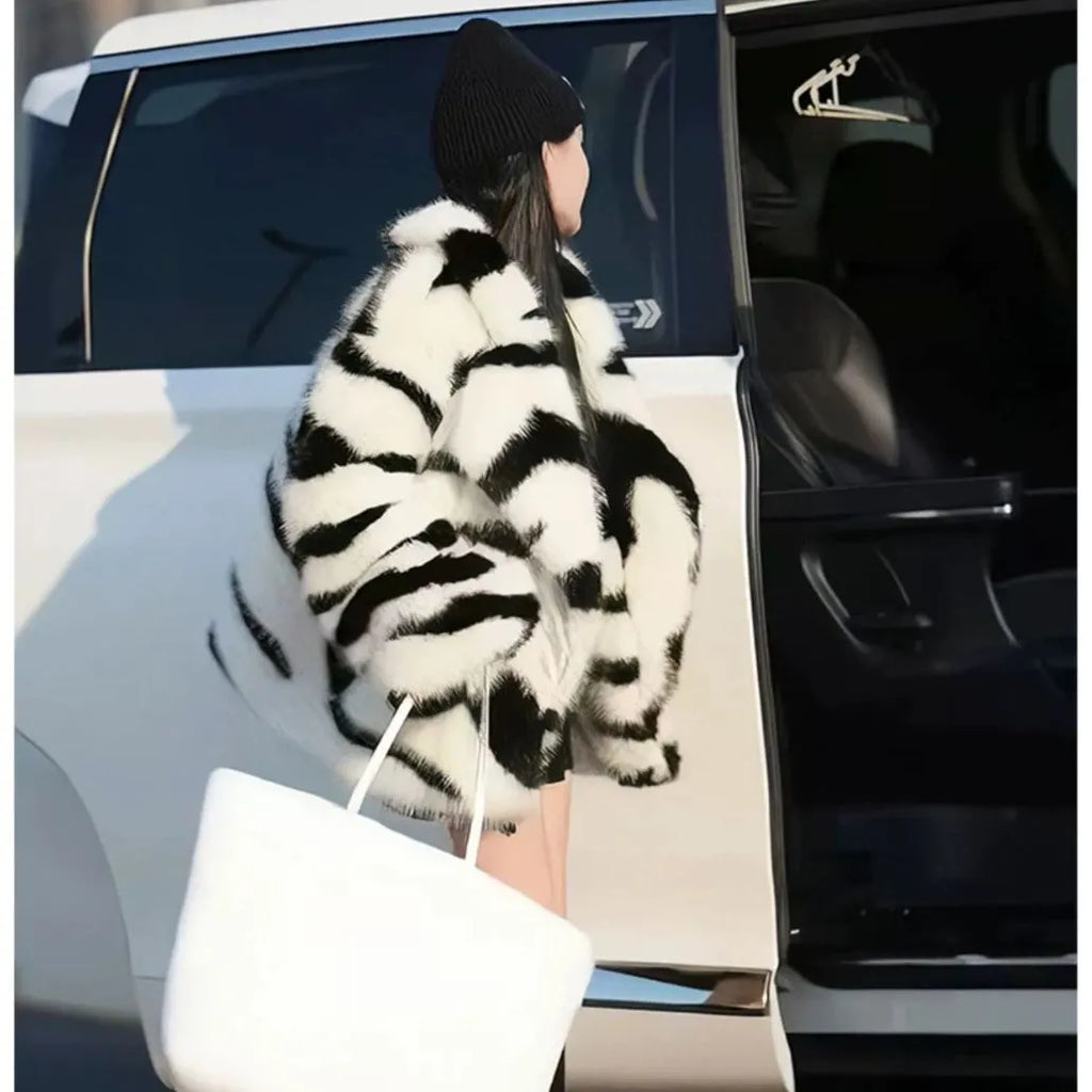 Zebra stripe women's top with fur fabric texture and large skimmer collar in street fashion style
