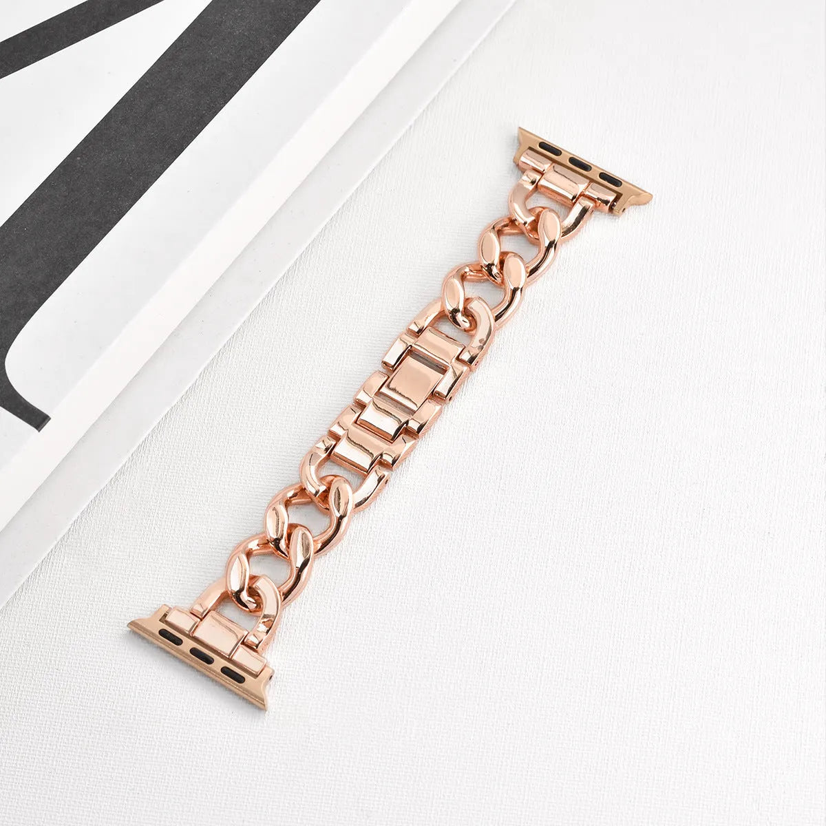 Metal denim chain watch strap for Apple Watch in multiple colours on a grey background.