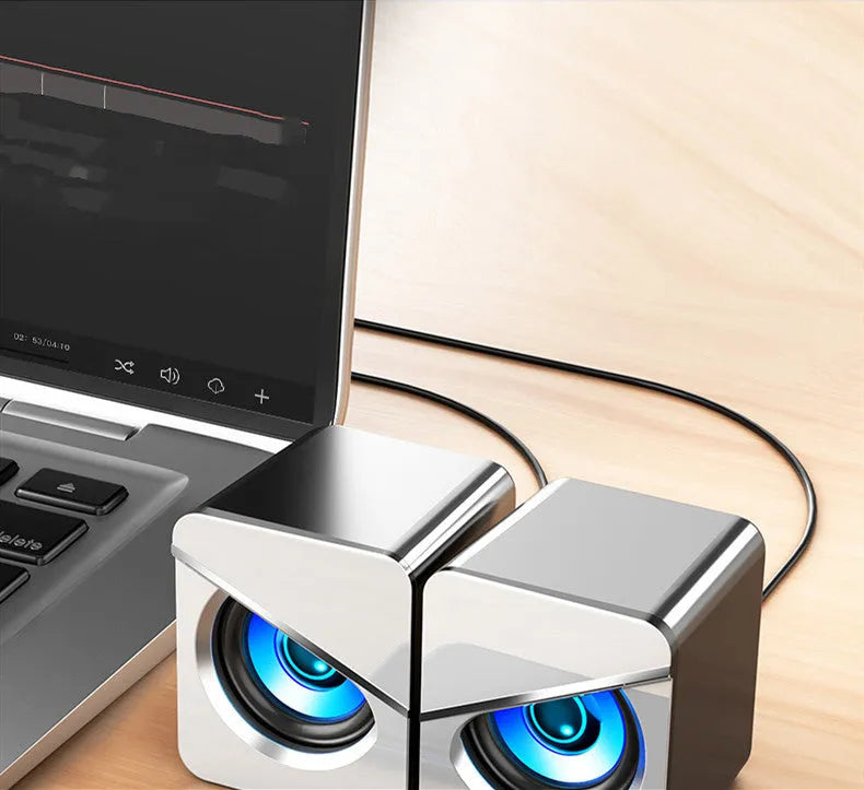Black and white USB mini computer speakers with cable for desktop audio