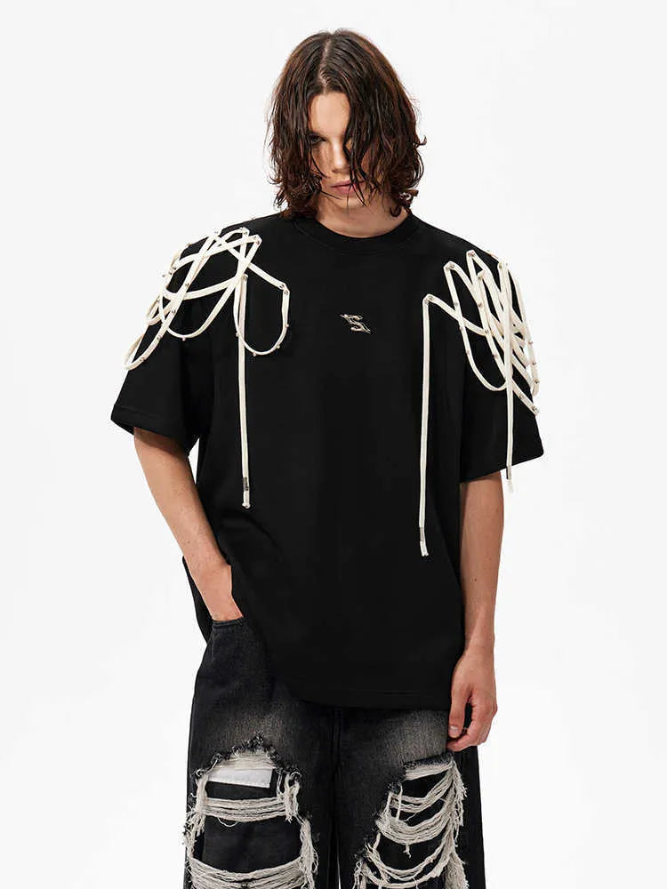 Black loose fit T-shirt with padded shoulders featuring rivet ribbon detailing, short sleeves and round neck collar