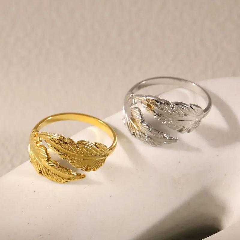 Women's adjustable feather design ring in gold and silver titanium steel options