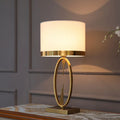 White single gilt-edged Nordic bedside lamp on wooden table, trumpet shade, diameter 30cm height 58cm