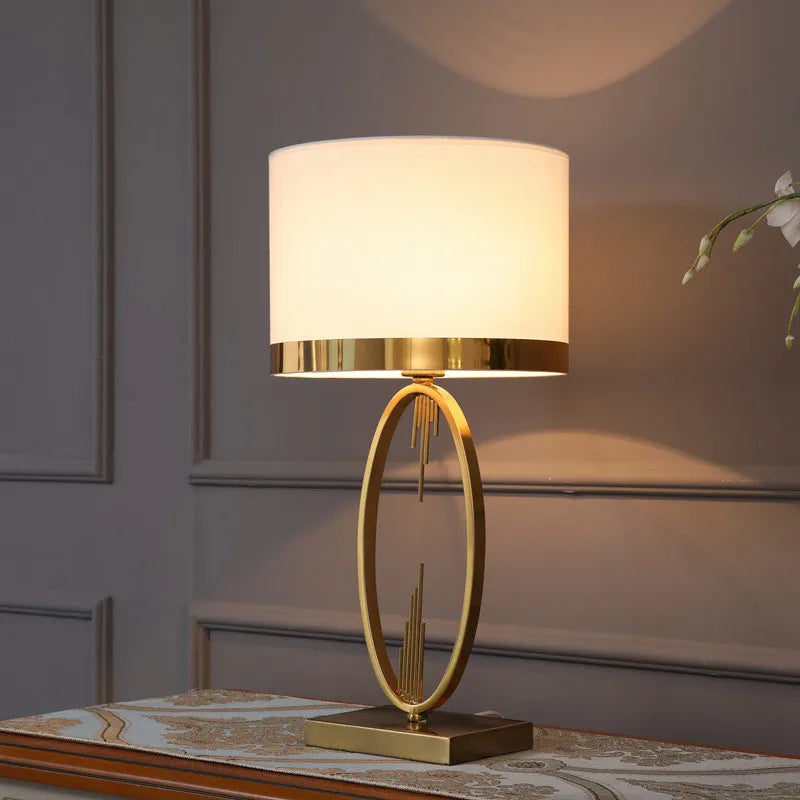 White single gilt-edged Nordic bedside lamp on wooden table, trumpet shade, diameter 30cm height 58cm