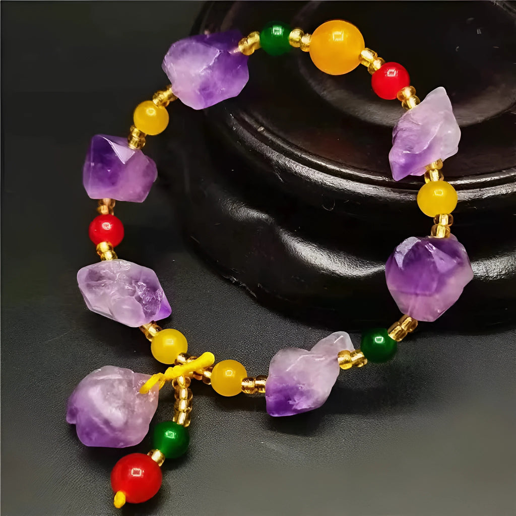 Purple natural shaped amethyst bead bracelet for women with a silver fu character charm.