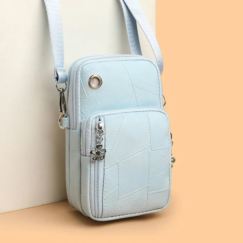 Brown PU leather vertical square mobile phone bag with crossbody strap and sandwich pocket.