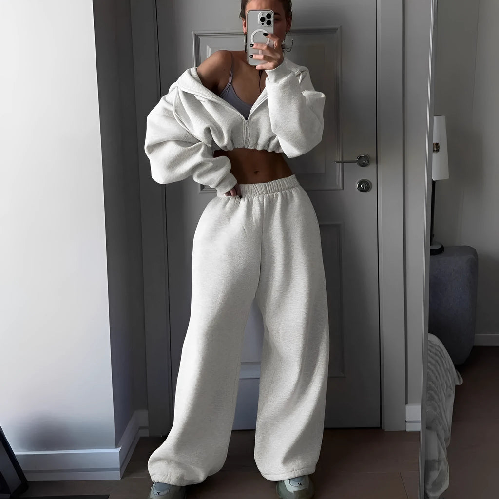Men's grey long sleeve polyester tracksuit set with coat and trousers laid flat.
