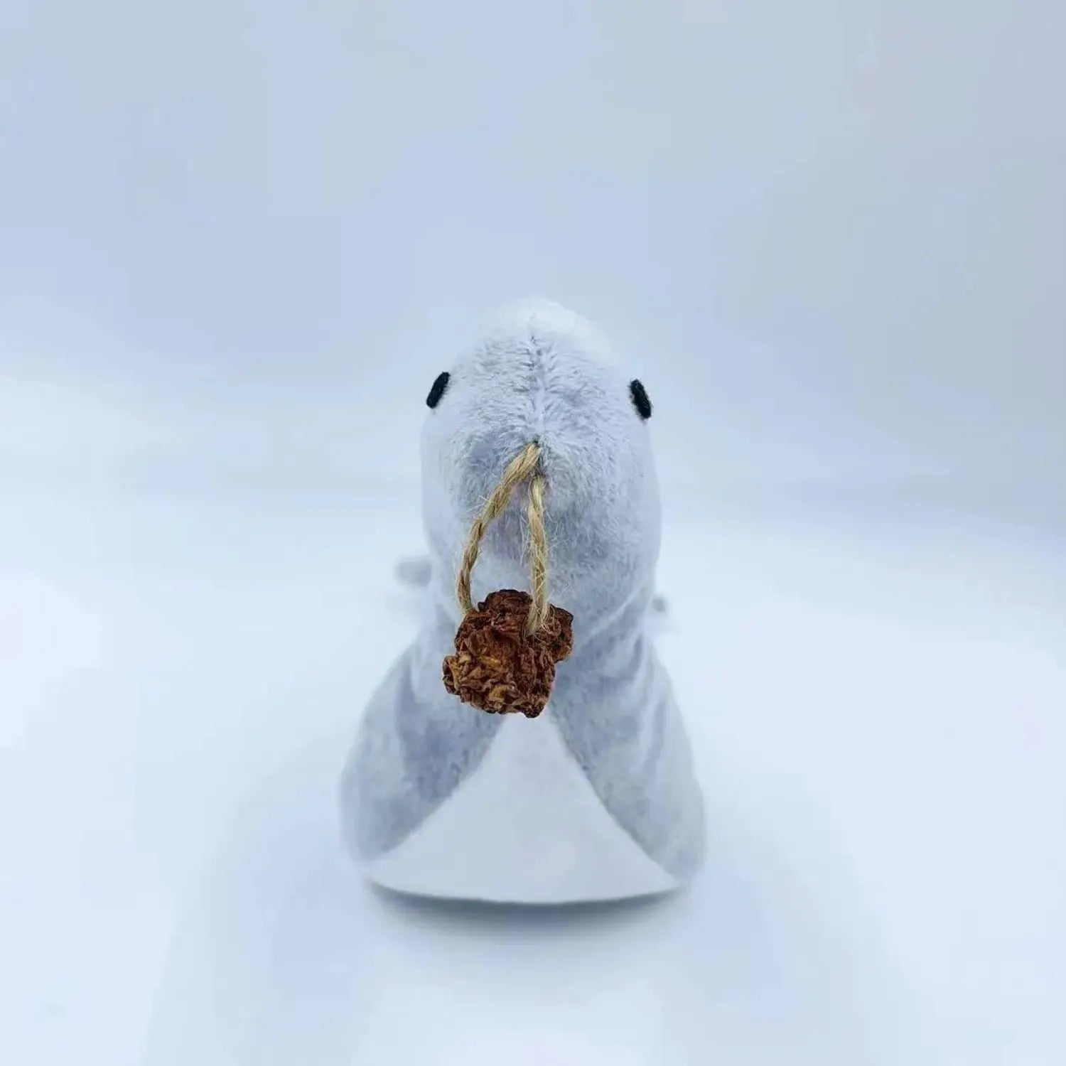 Blue sea lion plush cat toy with bell sound and catnip for teeth grinding and interactive play