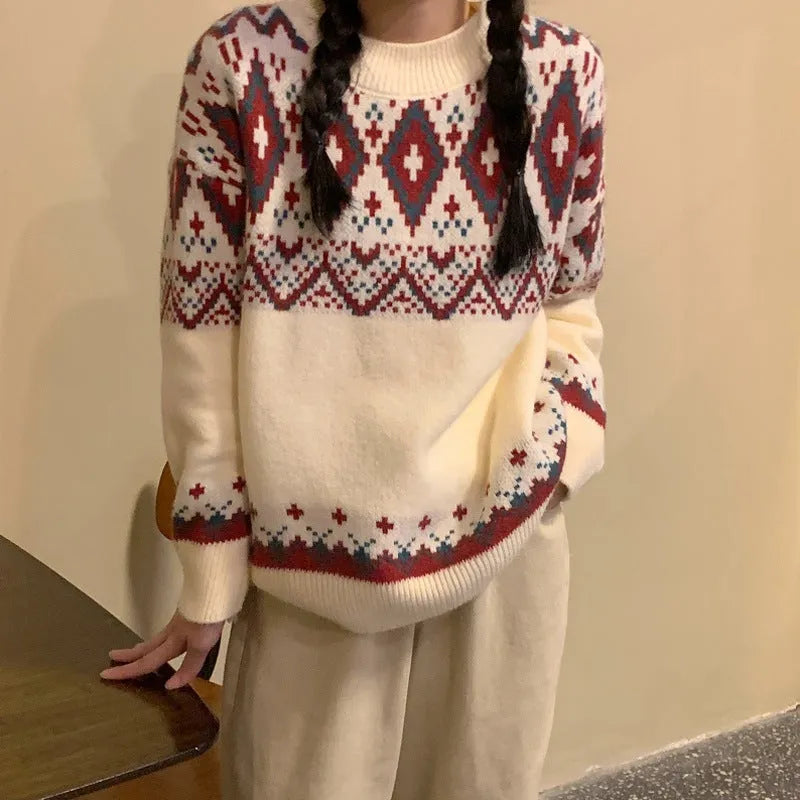 A loose-fitting striped knitted pullover top with long sleeves, shown in red and white colour options.