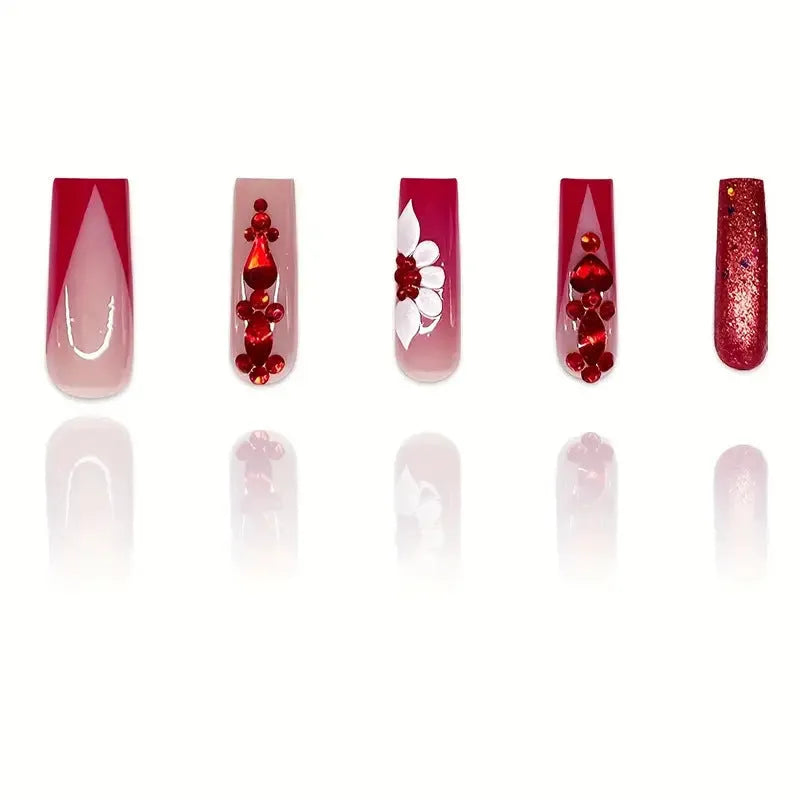 Artificial nails with floral pattern and red diamond accents in European square shape