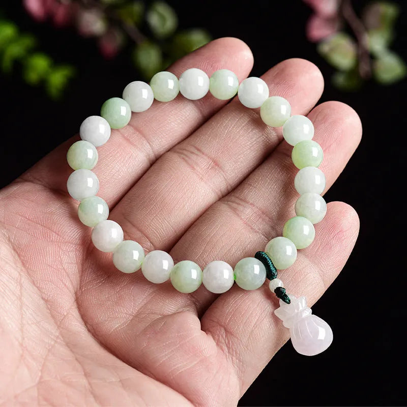 Jade stone bracelet with 8mm flower carving in unisex design for men and women