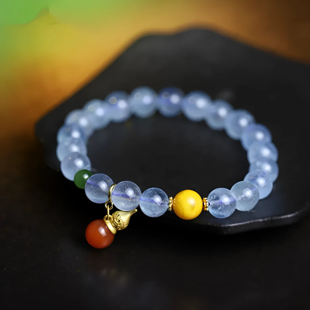 Iced aquamarine crystal bracelet with 8mm geometric beads and retro ethnic styling details