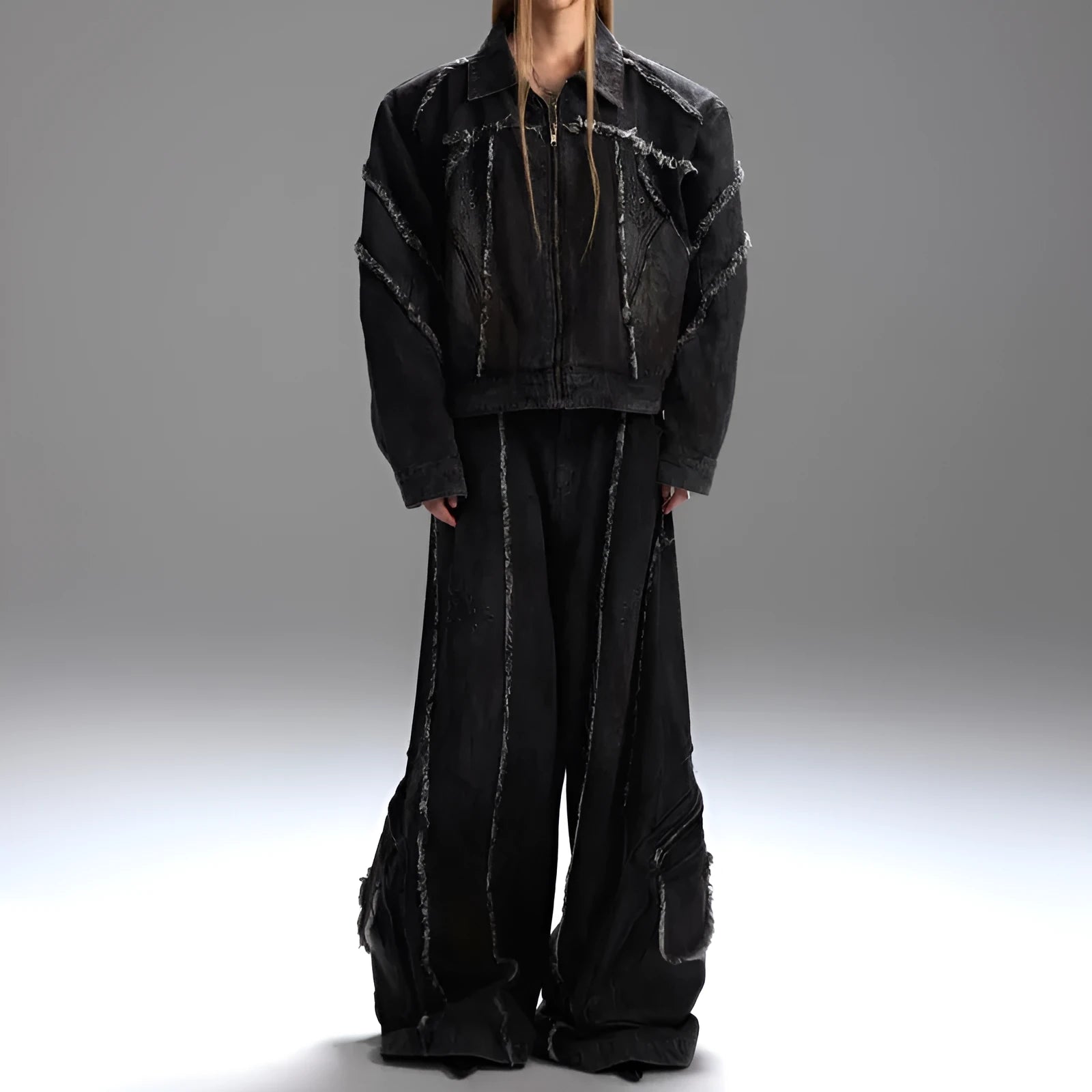 Black distressed denim coat and pants set with padded shoulders and gradient dye pattern