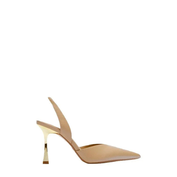 Women's pointed-toe patent leather high heels in nude colour with a shallow-cut vamp.