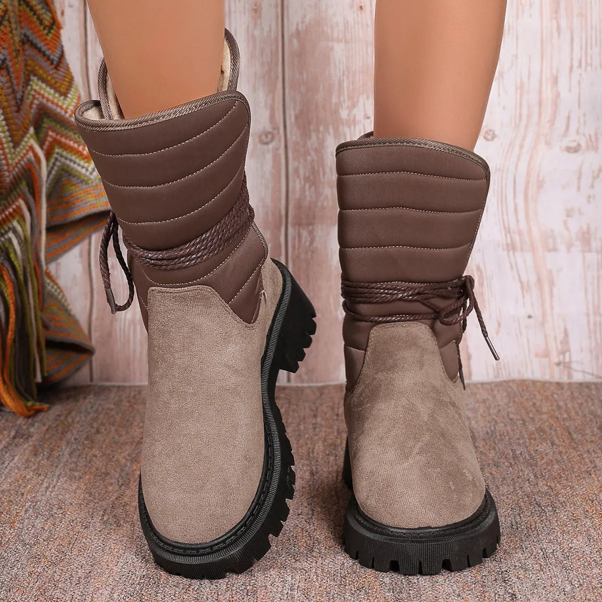 Women's black suede chunky heel snow boots with lace-up front and fleece lining.