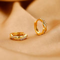 Geometric interwoven hemp rope earclip earrings in a gold or silver copper finish.