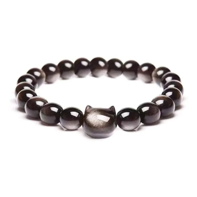 Handmade natural stone bead bracelet with silver cat pendant on neutral background