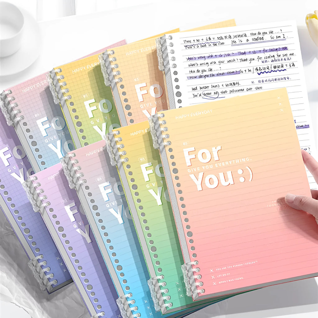 Removable coil gradient notebook in blue, green, pink, or purple, showing A4 and B5 size options.