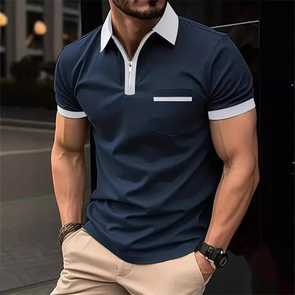 Man wearing a loose-fit men's short sleeve casual shirt with a chest pocket and zipper decoration.