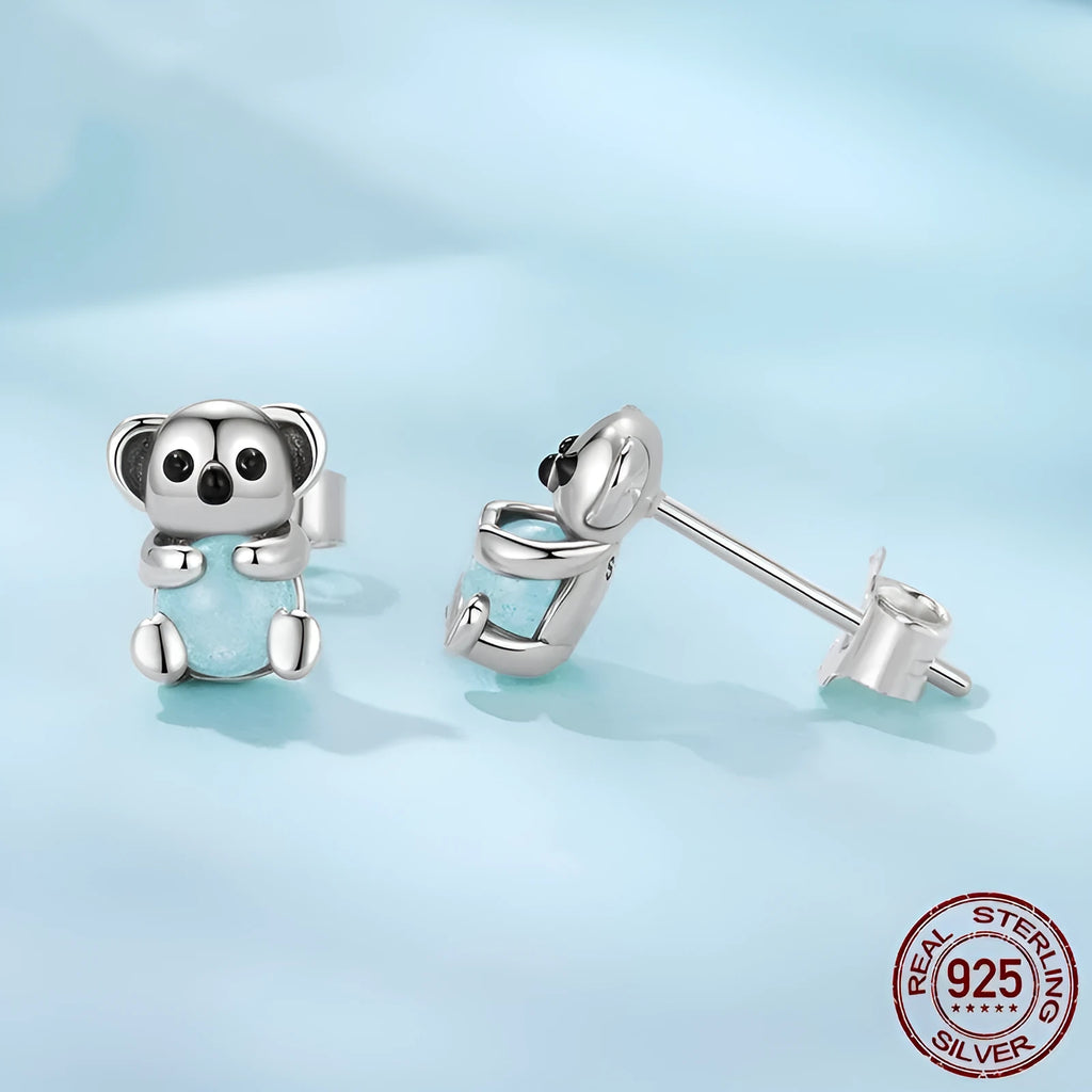 S925 sterling silver dangling koala bear earrings with dripping oil finish on a white background