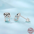 S925 sterling silver dangling koala bear earrings with dripping oil finish on a white background