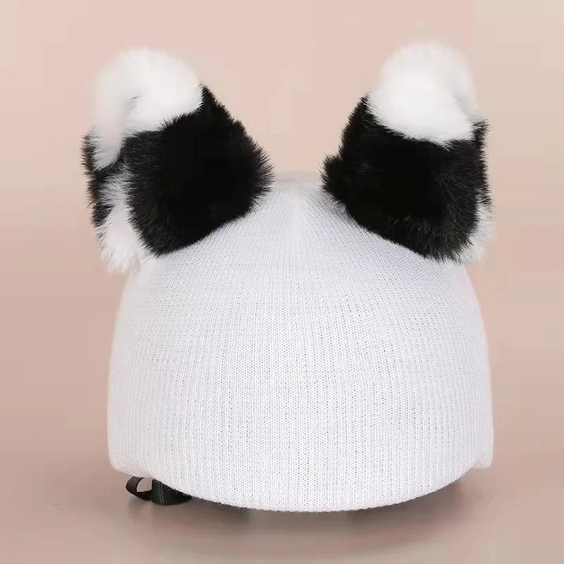 A soft plush cartoon character cover stretched over a medium-sized motorcycle helmet.