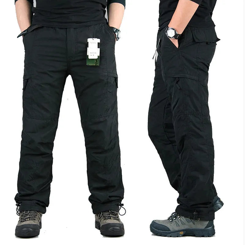 Men's thick khaki wool-lined cotton overalls with loose straight legs on a hanger