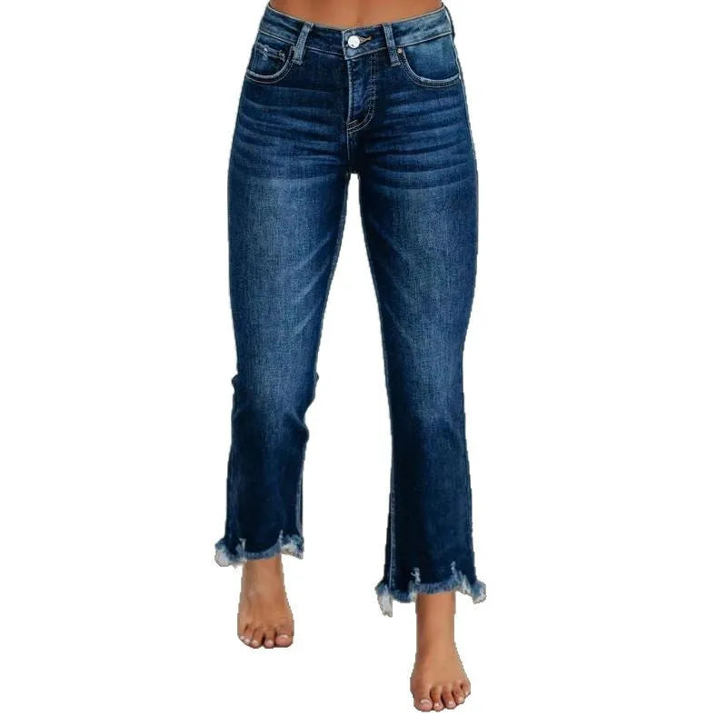Women's solid colour denim pants with hand-worn distressing in dark blue and light blue.